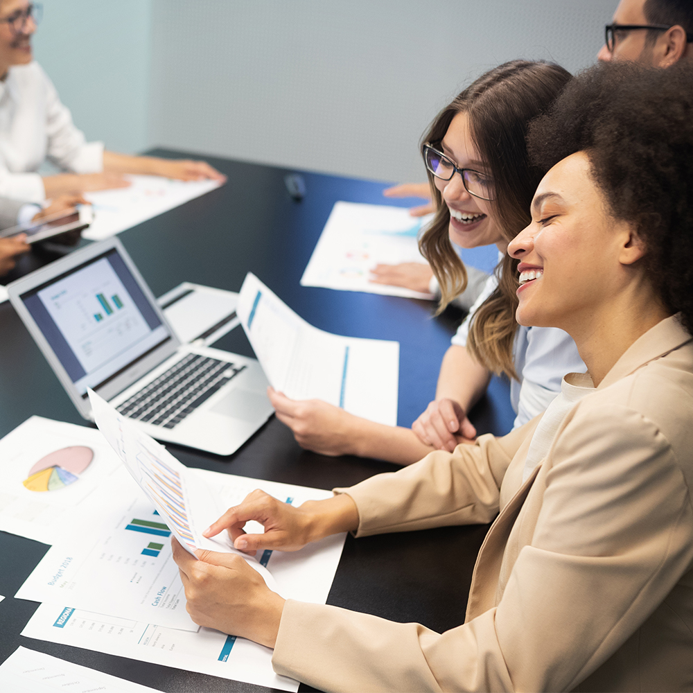 diverse group of employees at staff meeting in conference room