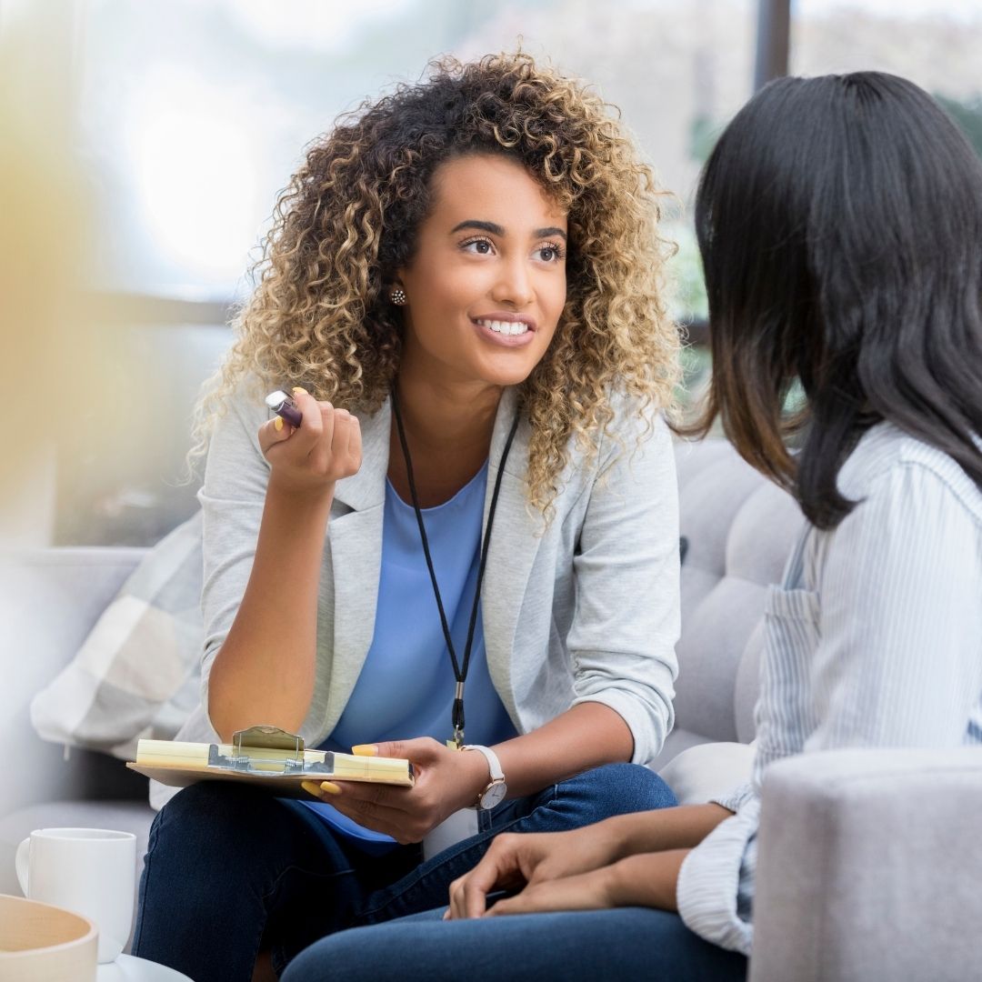 therapist talking with a patient