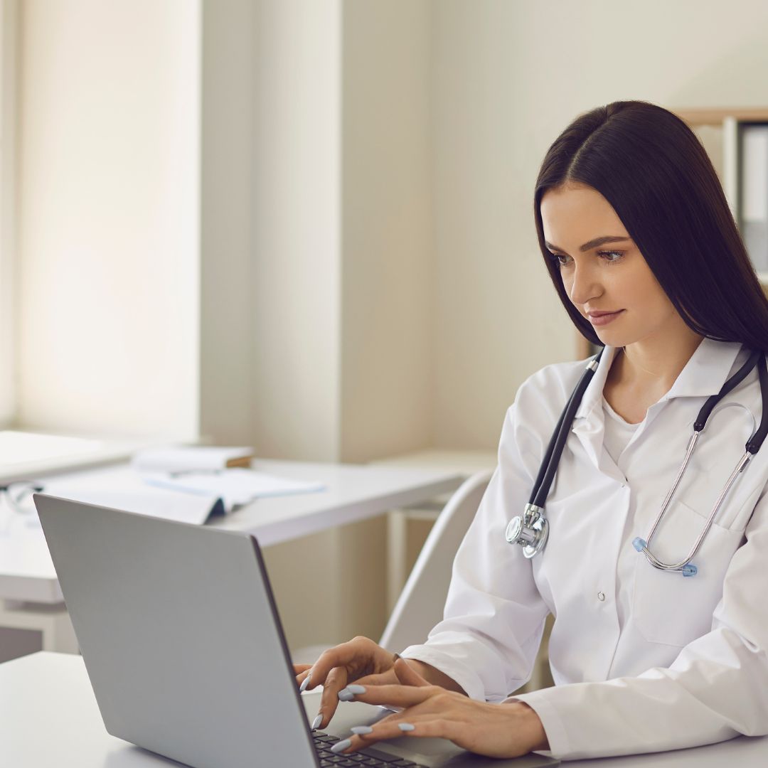Medical professional on laptop 